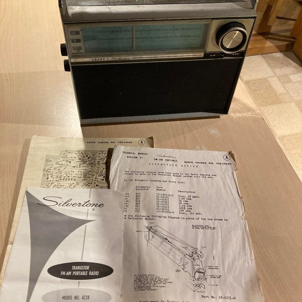Sears, Roebuck & Co.Silvertone portable radio model 4228 from 1964 with books